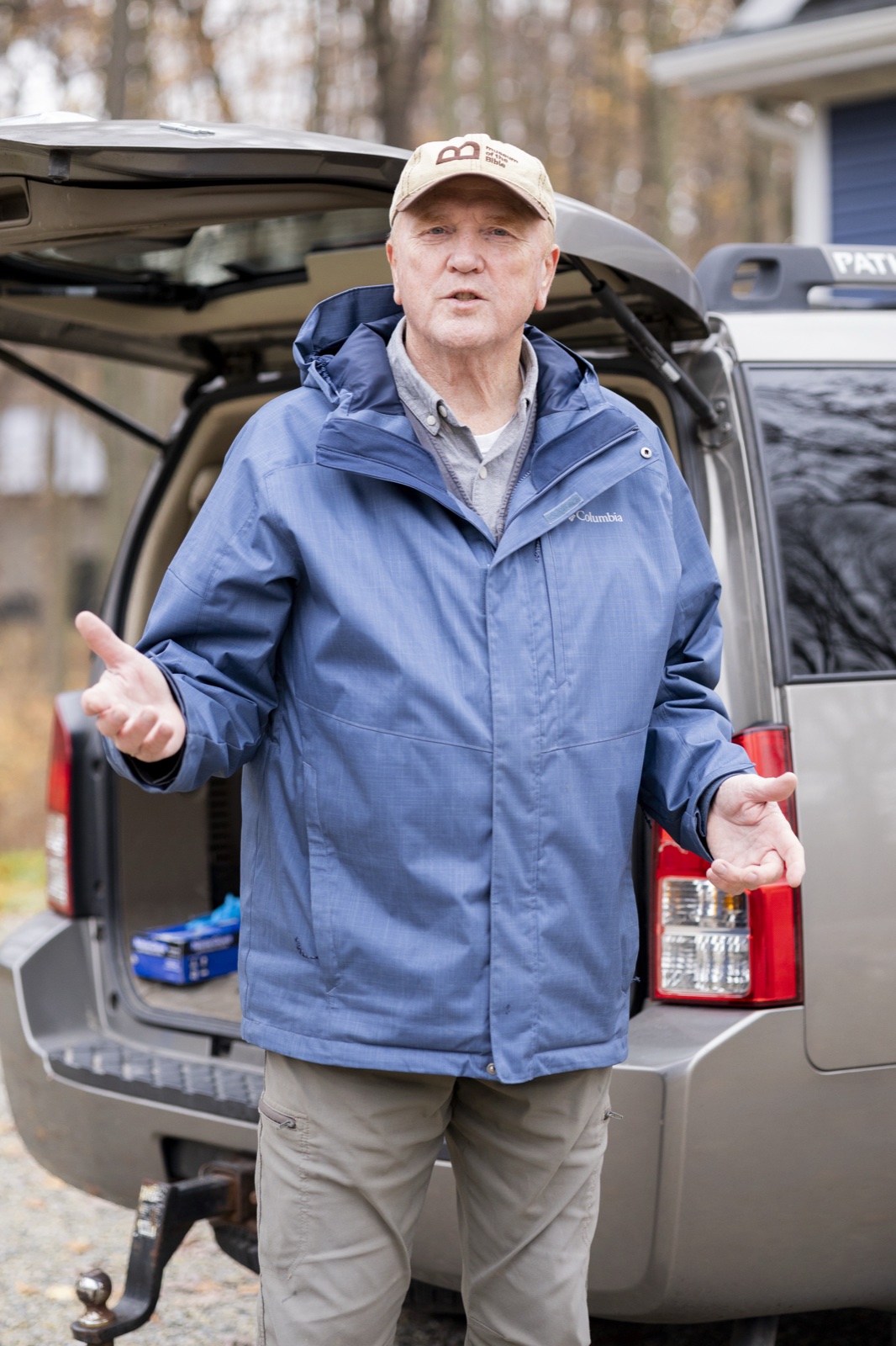 Rick Townsend speaking with a homeowner at the inspection truck